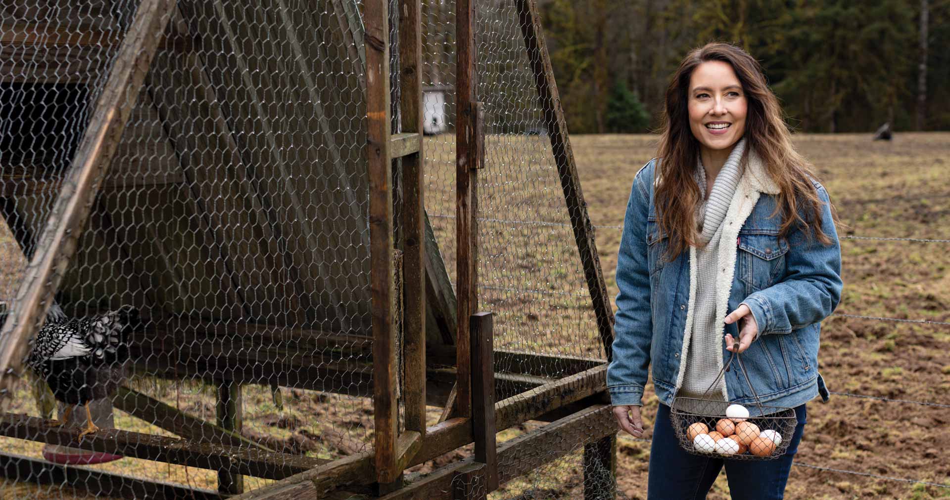 Melissa Norris gathering eggs on her homestead